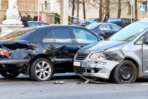 Car crash on the street with damaged vehicles.