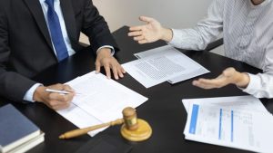 A client discusses a financial fraud issue with a lawyer in a litigation room, seeking legal guidance. The scene reflects courtroom ethics, emphasizing justice, legal consultation, and the Scales of Justice in the litigation process. 